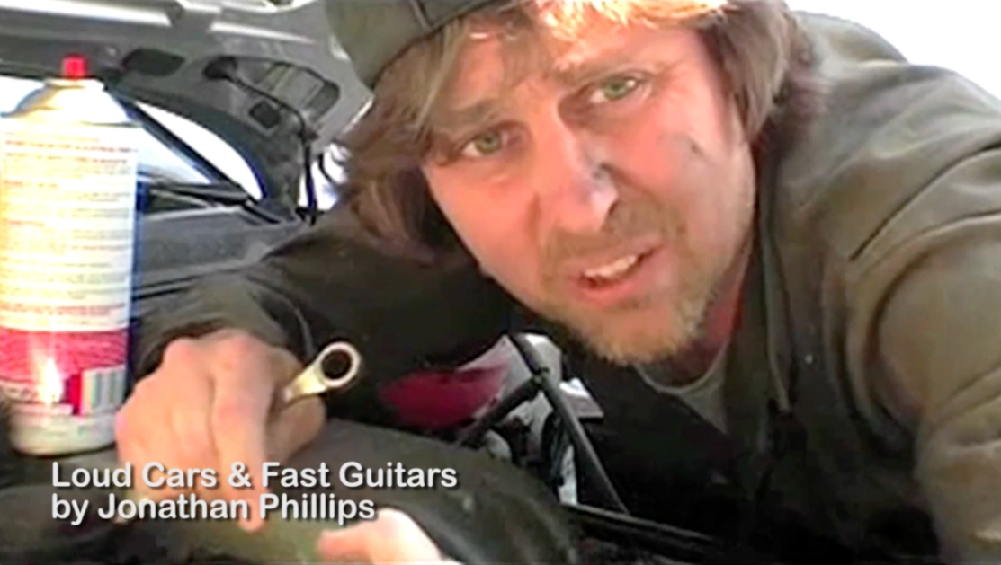 Photo of Jonathan Phillips as a mechanic from the short film Loud Cars